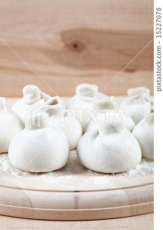 Manti dumplings on a wooden board. 15227078