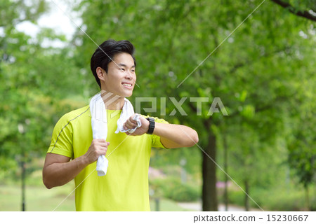 Young Chinese man time check 15230667