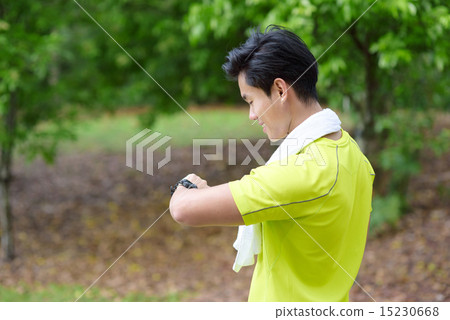 Young Chinese man time check 15230668