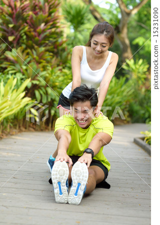 Young Chinese couple doing stretching exercise Young Chinese couple doing stretching exercise 15231090