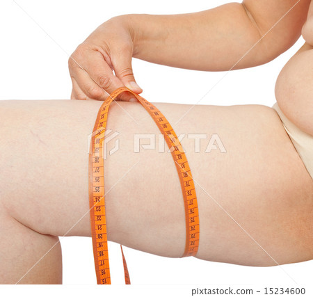 Fat woman measure her leg Fat woman measure her leg 15234600
