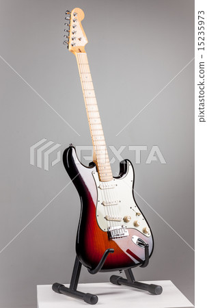 Electric guitar isolated on gray background Electric guitar isolated on gray background 15235973