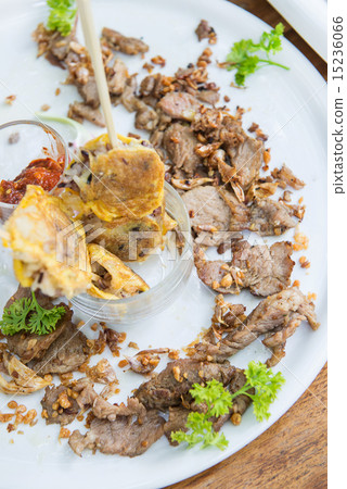 Fried pork with garlic and omelet on stick 15236066