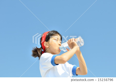 Girl drinking water in blue sky (gym suit, hachimaki) Girl drinking water in blue sky (gym suit, hachimaki) 15238796