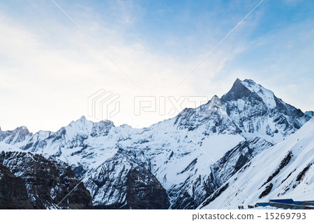 Peak of Mount Machapuchare with base camp below 15269793