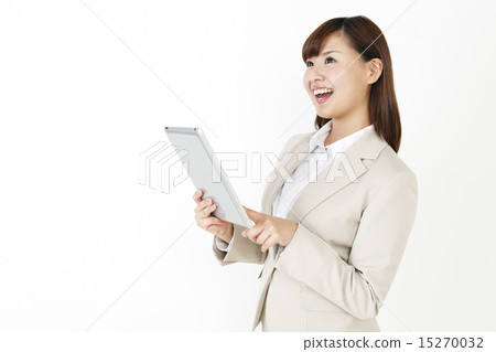 A woman with a smile suit with a tablet 15270032