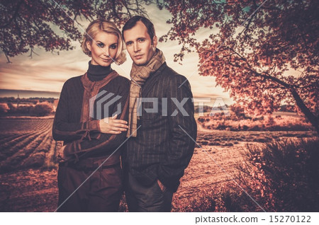 Elegant couple against lavender field Elegant couple against lavender field 15270122