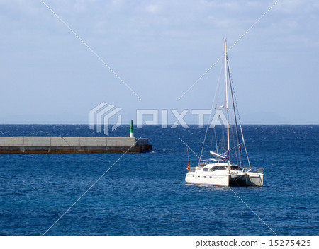Catamaran anchored near jetty 15275425