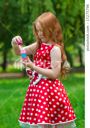 Beautiful dress girl with soap bubbles in summer Beautiful dress girl with soap bubbles in summer 15275796