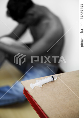 Syringe and drug addict 15285153