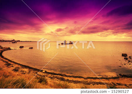 Purple sunset over beach with dramatic sky Purple sunset over beach with dramatic sky 15290527