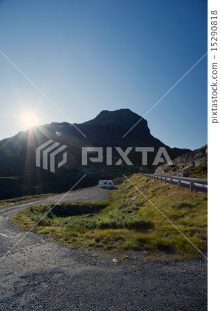 Sun shining on the road through mountain plateau  15290818