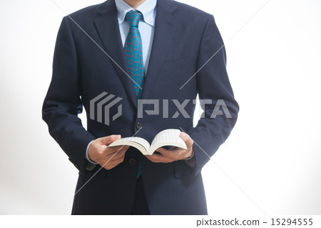 A businessman who refers to a book 15294555
