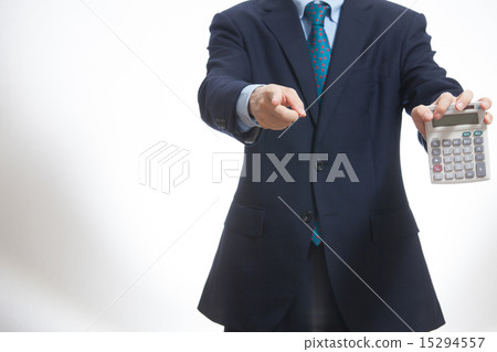 Businessman with a calculator Businessman with a calculator 15294557