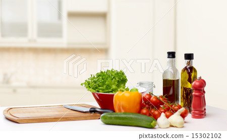 vegetables, spices and kitchenware on table vegetables, spices and kitchenware on table 15302102