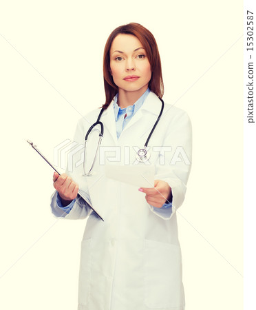 calm female doctor with clipboard 15302587