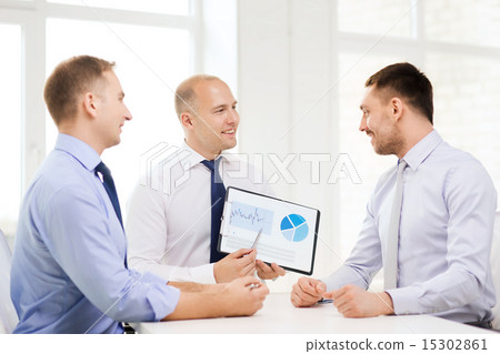 smiling businessmen with papers in office 15302861