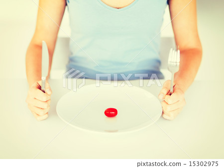 woman with plate and one tomato woman with plate and one tomato 15302975