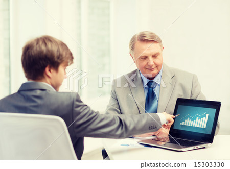 older man and young man with laptop computer older man and young man with laptop computer 15303330