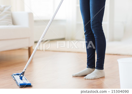 close up of woman with mop cleaning floor at home 15304090