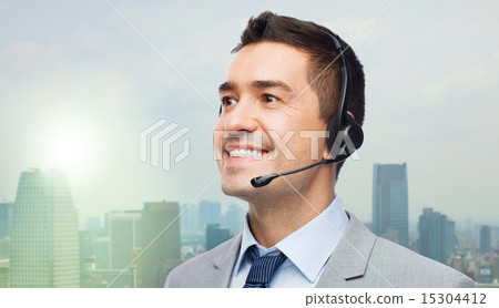 smiling businessman in headset smiling businessman in headset 15304412