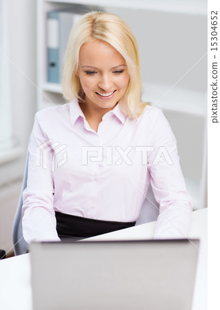 smiling businesswoman or student with laptop smiling businesswoman or student with laptop 15304652
