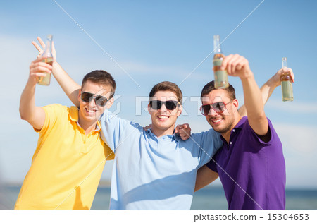 happy friends with beer bottles on beach happy friends with beer bottles on beach 15304653