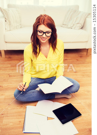 smiling teenage girl with tablet pc at home smiling teenage girl with tablet pc at home 15305114
