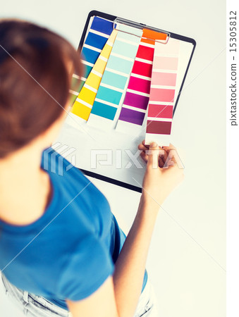 woman working with color samples for selection woman working with color samples for selection 15305812