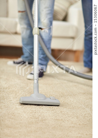 close up of human legs and vacuum cleaner at home close up of human legs and vacuum cleaner at home 15306067