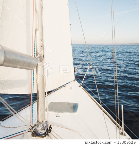 Yacht sailing towards the sunset Yacht sailing towards the sunset 15309529