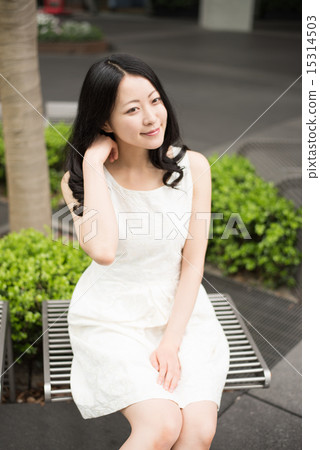 Woman sitting on chair Woman sitting on chair 15314503