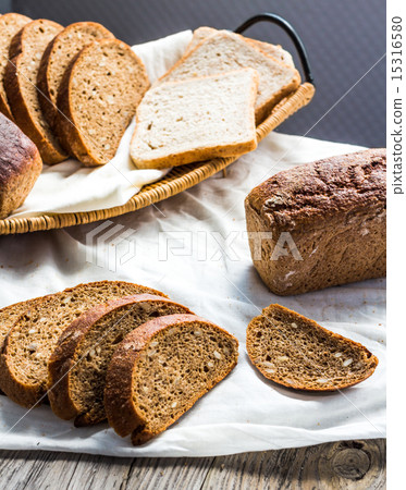 assortment of baked bread, slices of rye bread 15316580