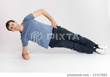 Athlete holding body leaning on the right arm Athlete holding body leaning on the right arm 15317665