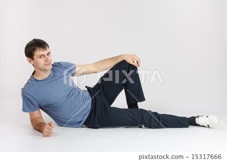 Athlete resting reclining after complex of exercises Athlete resting reclining after complex of exercises 15317666