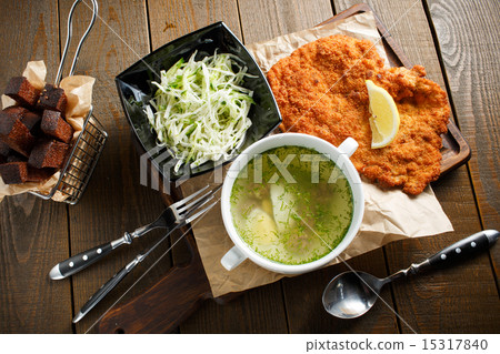 Chicken broth with egg, fried meat in batte Chicken broth with egg, fried meat in batte 15317840