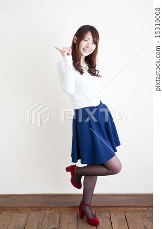 Blue skirt girl pointing at Blue skirt girl pointing at 15319008