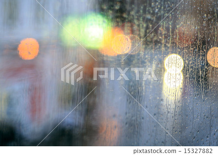 window rain blurred city lights 15327882
