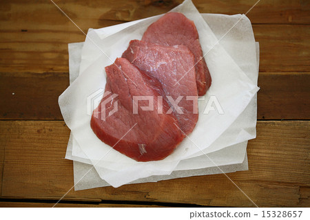 fresh meat tenderloin on the old wooden background fresh meat tenderloin on the old wooden background 15328657