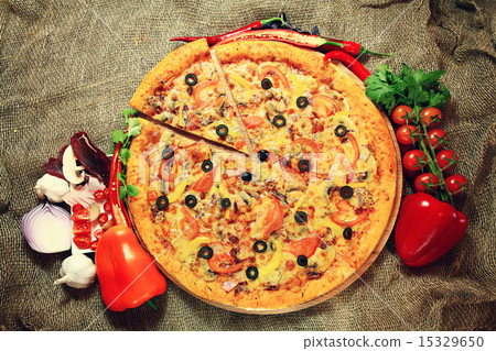 pizza with vegetables and herbs rustic background 15329650