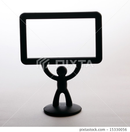 plastic figurine of a man with a placard on white background 15330056