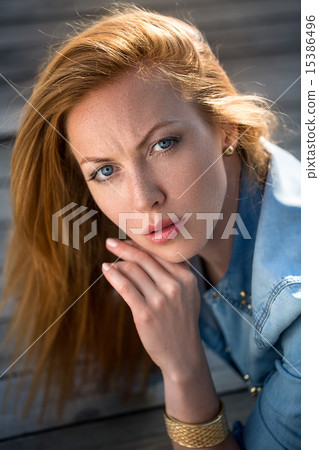 fashion portrait of strict red-haired girl 15386496