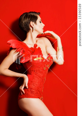 Young beautiful girl in red dancing suit Young beautiful girl in red dancing suit 15390589