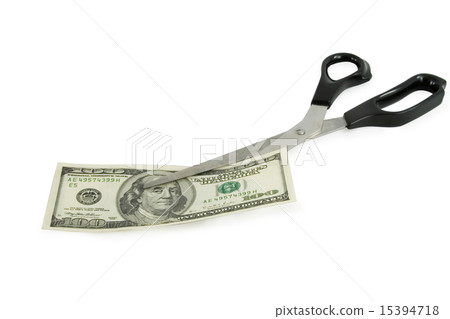 scissors cutting a 100 dollars banknote scissors cutting a 100 dollars banknote 15394718