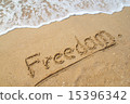 Word FREEDOM on the beach. 15396342