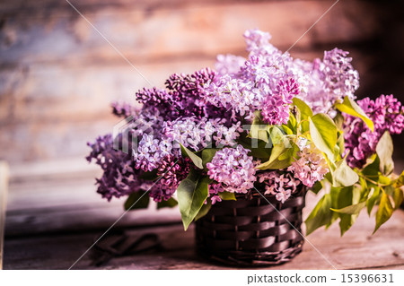 Bouquet of lilacs on wooden background 15396631