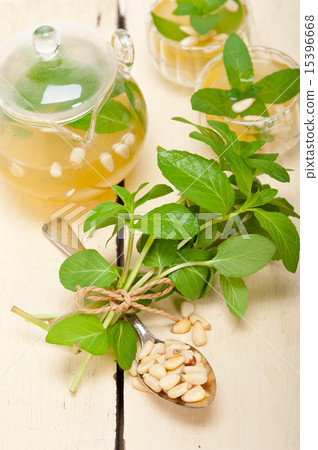Arab traditional mint and pine nuts tea Arab traditional mint and pine nuts tea 15396668
