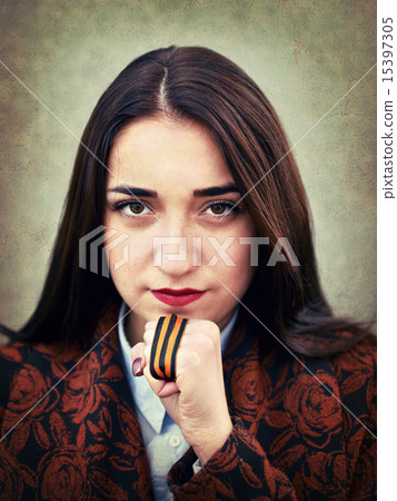 Portrait of young girl with St. George's ribbon in hand 15397305