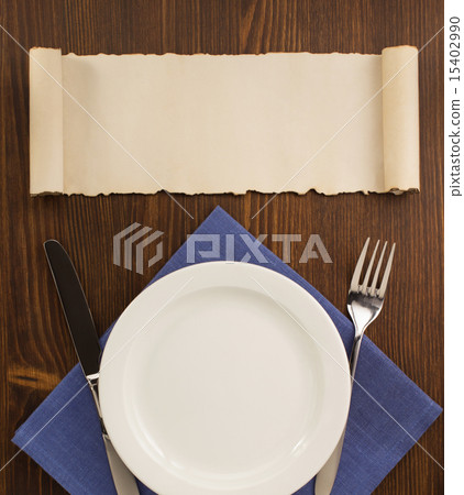 kitchen utensils at cloth napkin on wood 15402990