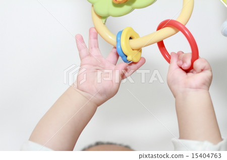 Baby's hand trying to catch a toy (0-year old child) Baby's hand trying to catch a toy (0-year old child) 15404763
